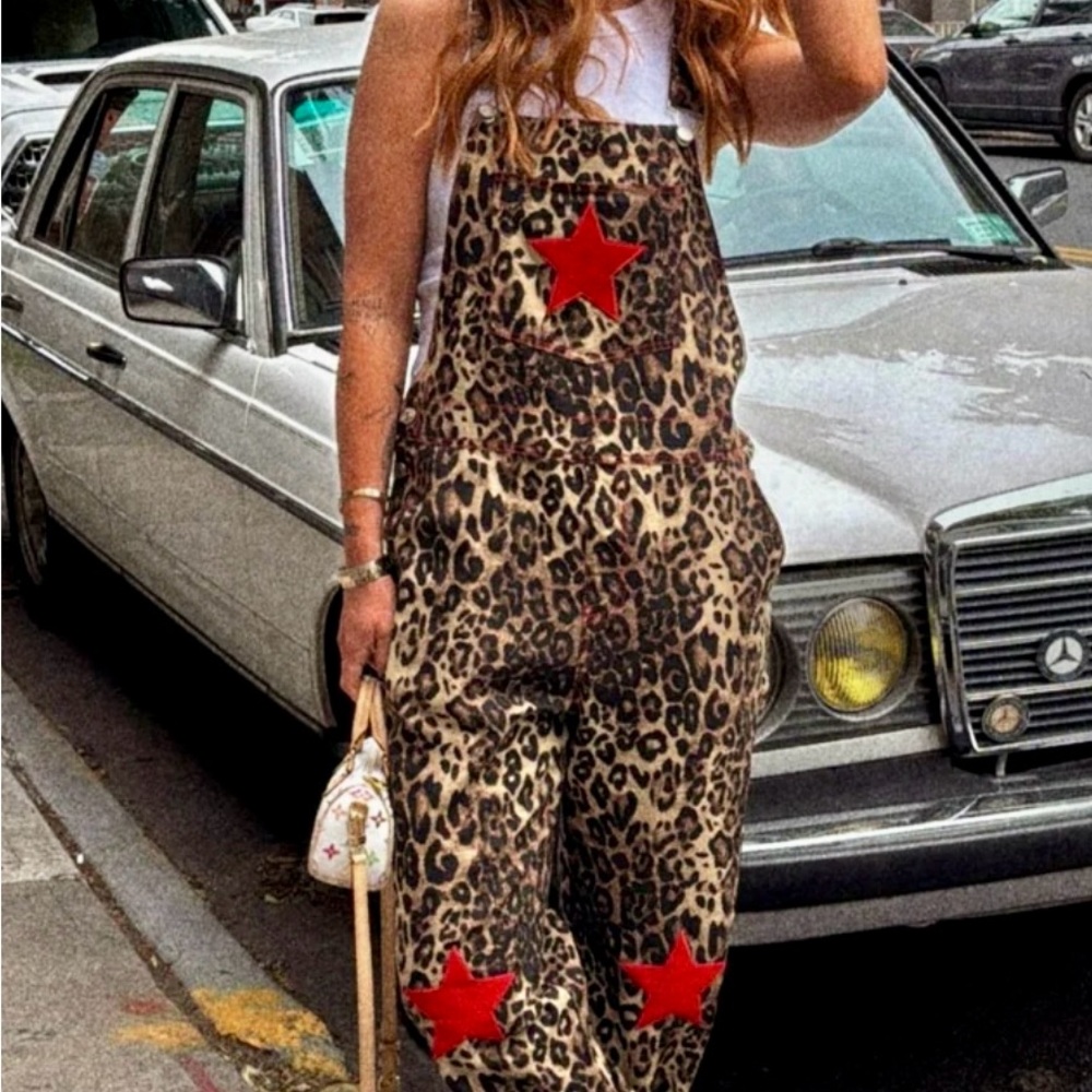 Dressed in LALA Leopard Jumpsuit with Red Stars